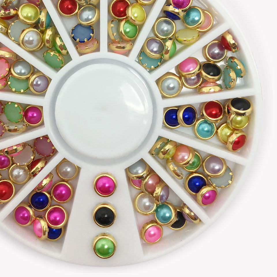 Pearl Nail Studs In Mixed Colours. Beautiful half pearls in a mix of colours, clasped in gold.