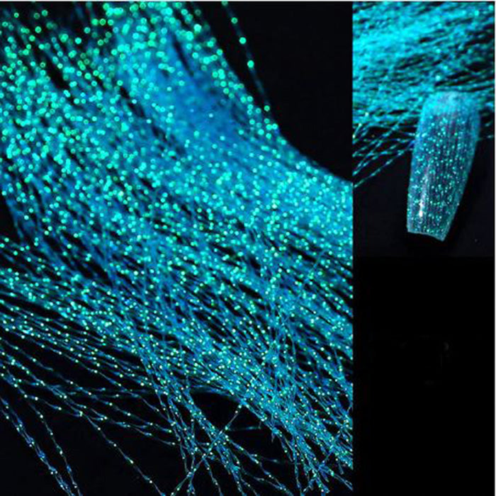 Bright blue corrugated/rippled threads with sparkling areas, used in nail art.