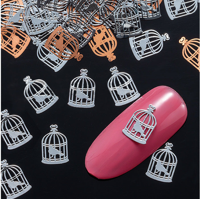Silver Bird in Cage Nail Slices, these are beautiful and very unusual. Thin metal slices, so they can be bent to fit your nail shape.