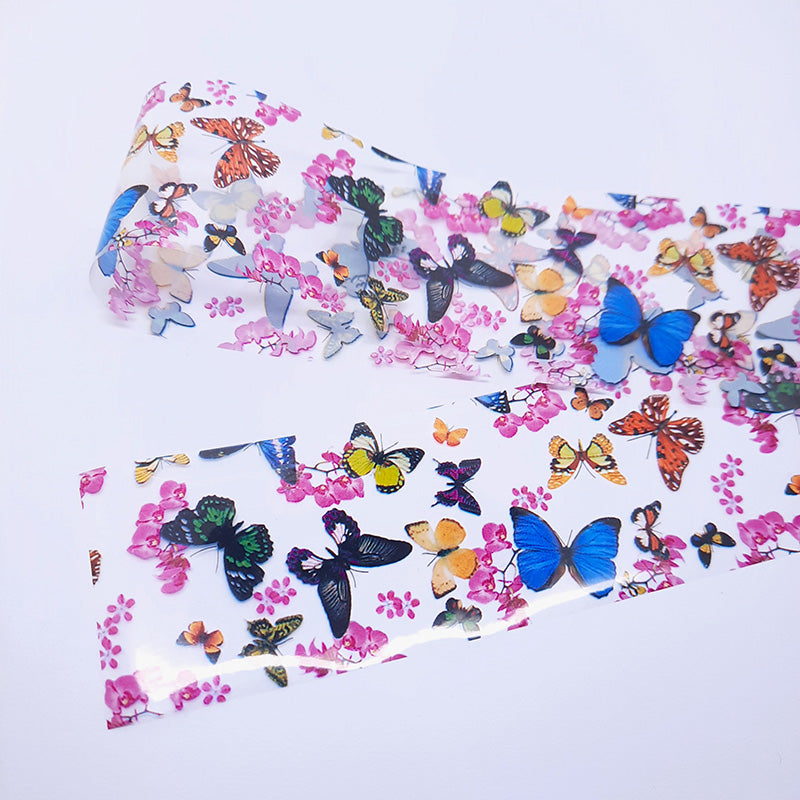 Butterfly and floral patterned nail art foil on a white background