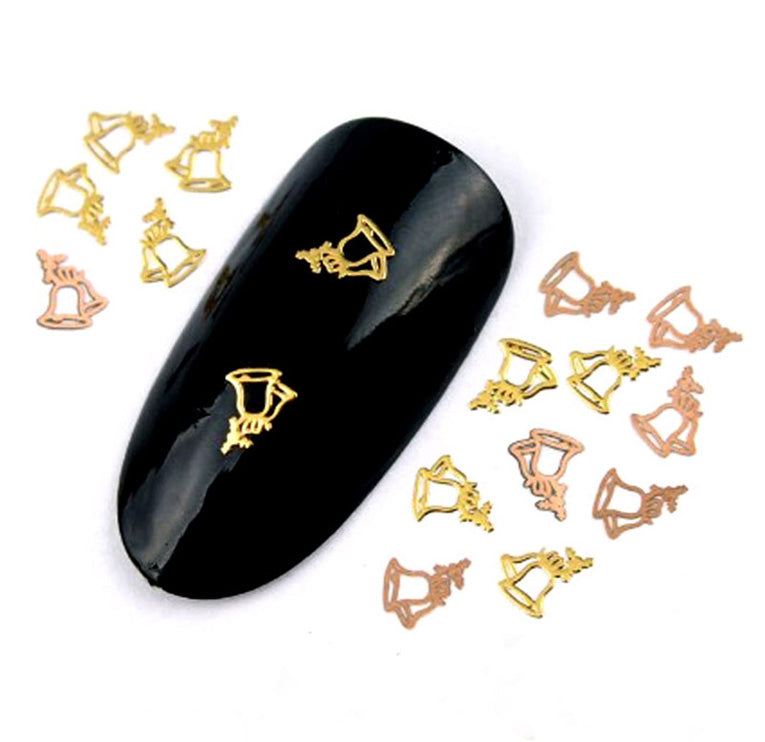 A set of gold metal Christmas bells nail slices designed for nail art, displayed on a black background.