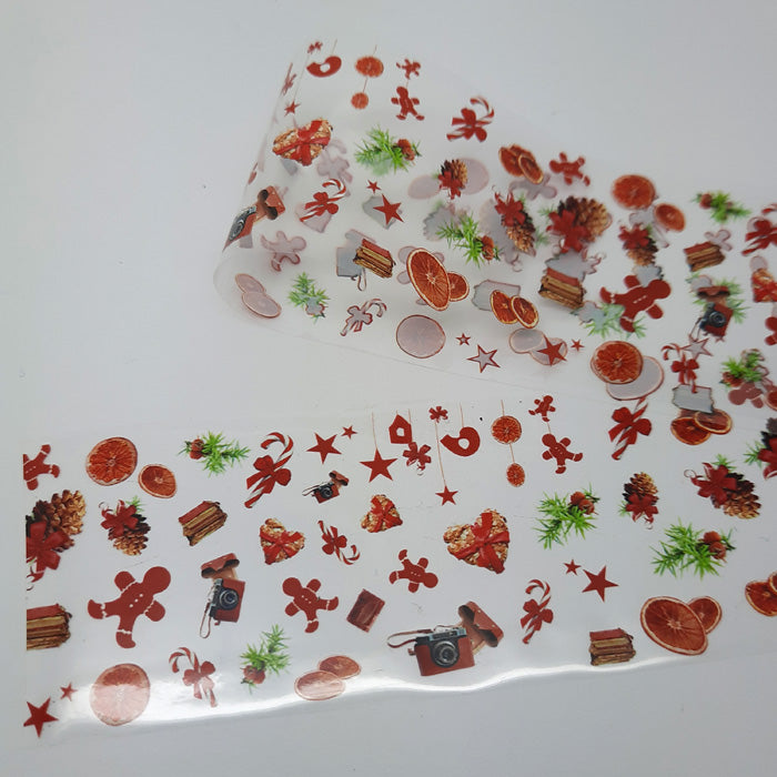 A sheet of Christmas nail foil with gingerbread men and various holiday-themed designs.