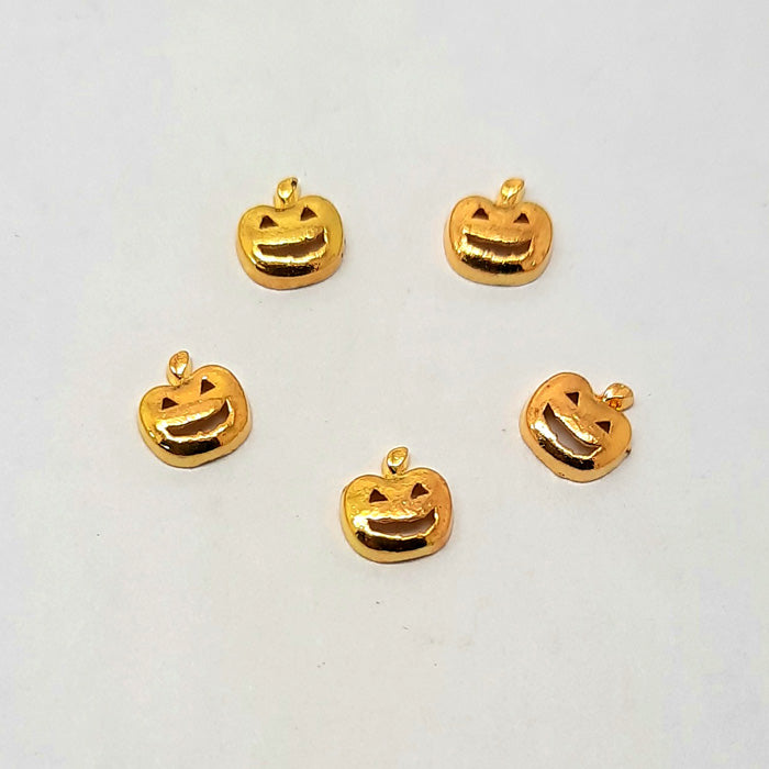 Cute Halloween Pumpkin Nail Charms x 4. Cute gold metal smiling pumpkins.
