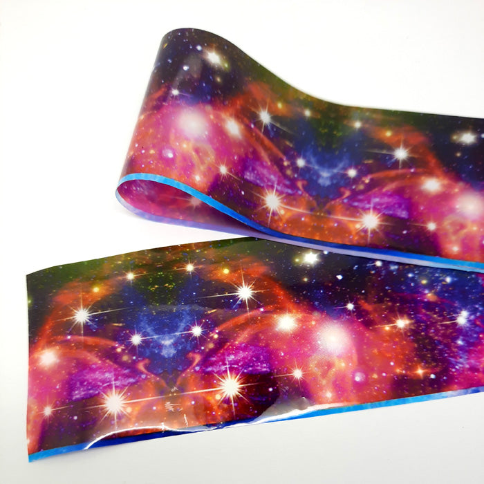 Galaxy Nail Foil, Starbright. Beautiful colours and lots of stars.
Supplied in 4cm x 100cm lengths.