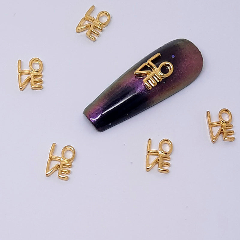 Love Nail Charms, Gold. Beautiful gold metal nail charms, slightly curved back for a good fit.
