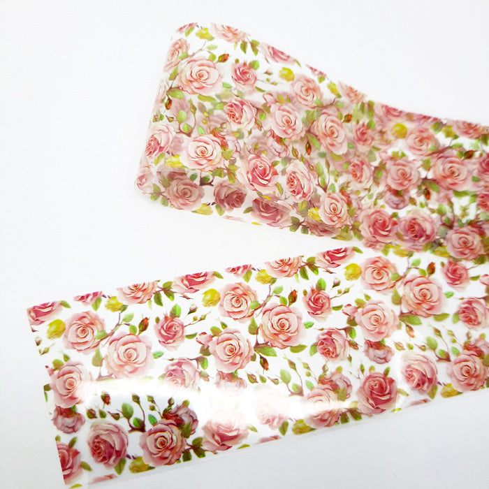 Floral nail art foil with pink roses displayed on a white background