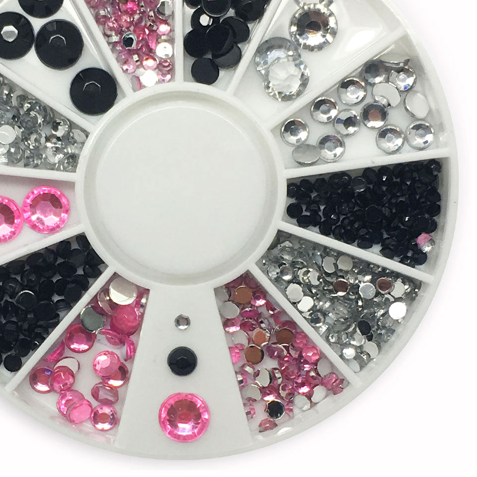 Black, Pink,+ Silver Nail Rhinestones, in a mix of sizes. Flat backed.