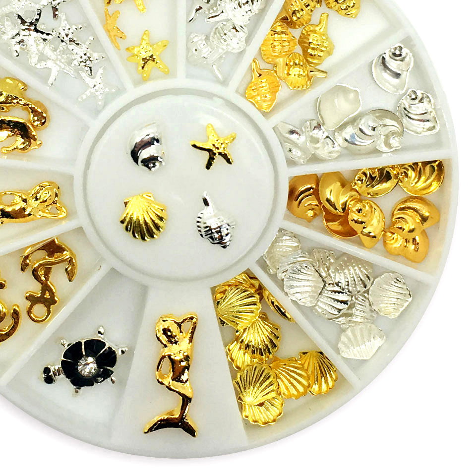 Gold + Silver Seaside Nail Charms. A lovely mix of shells, starfish, anchors, mermaids and a cute turtle.