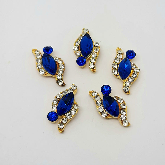 Marquise Crystal Nail Charms, Blue. Beautiful nail charms with a large blue crystal set into gold metal, embedded with smaller clear gems. Flat backed. Other colours also available.