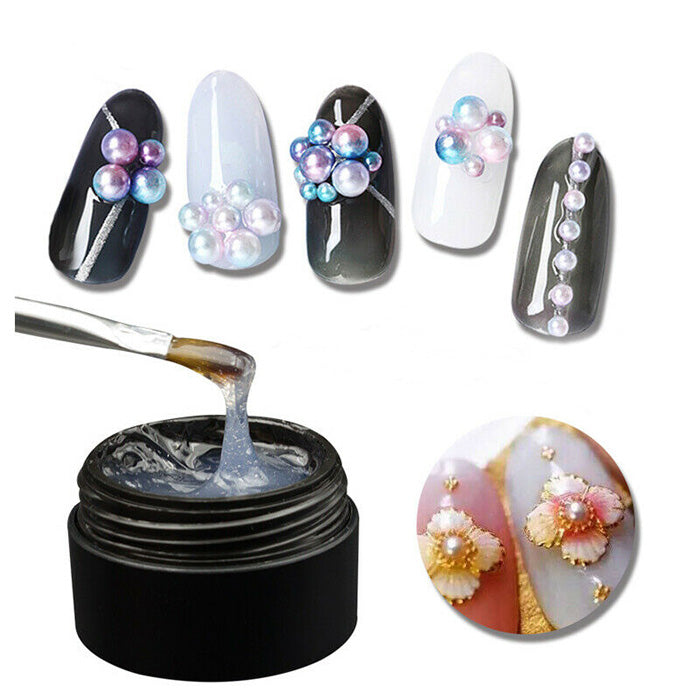 Nail Art Gem + Crystal Glue, Clear. Apply to nail, press decoration onto glue, cure. Fill in any gaps with more glue, cure again. Top coat can then be applied. Soak off to remove.