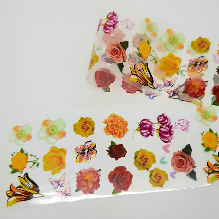 Yellow, Red + White Flowers Foil. A beautiful foil with lots of flowers on a clear backing.
Supplied in 4cm x 100cm lengths.