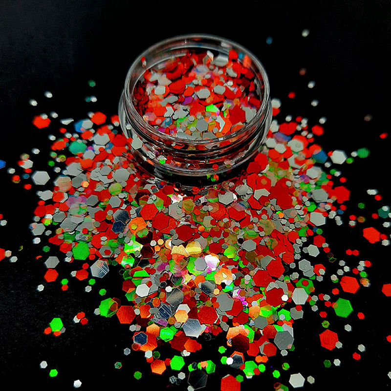 Orange + Silver Iridescent Nail Glitter, 'Silver Oranda'. A beautiful nail glitter in lovely colours. Hexagon pieces of mixed sizes, which are silver and a beautiful orange, with more hexagons that are translucent with an iridescent green tinge.