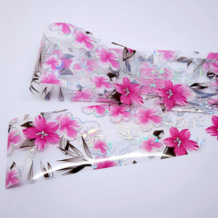 Pink + Silver Holo Flowers Nail Foil, beautiful large pink flowers on a clear backing.
Supplied in 4cm x 100cm lengths.