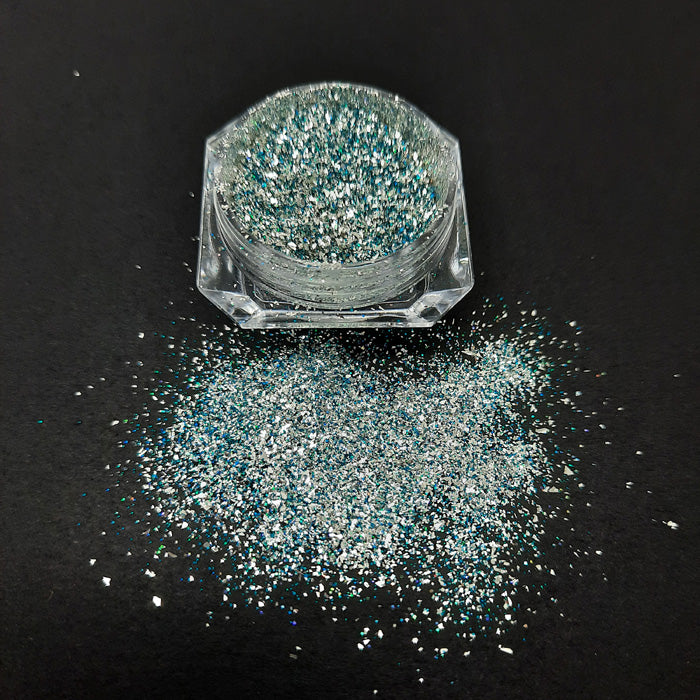 Platinum Nail Glitter with Blue + Green. This is a stunning nail glitter, in the brightest and shiniest silver, with little coloured pieces.