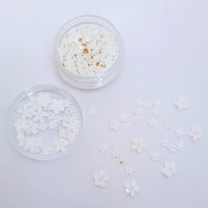 Flowers + Gold Caviar Beads Nail Decoration, White. Gorgeous little white 3d flowers in mixed sizes, with added gold caviar beads, which you can use in the centre of the flowers if required.