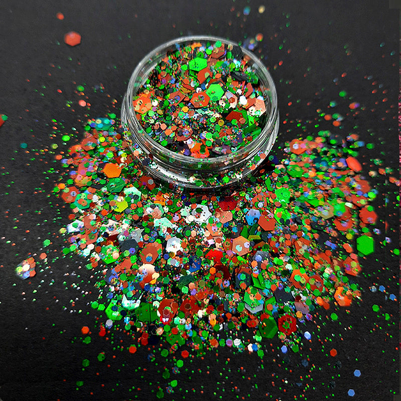 Sparkly Nail Glitter 'Swing Away Merrill'. This nail glitter is so sparkly and the colours are to die for. 3mm hexagons in red and green, with tiny 1mm hexagons in red, green, and an iridescent purple, all in an incredibly sparkly powder. ps.... guess the movie....