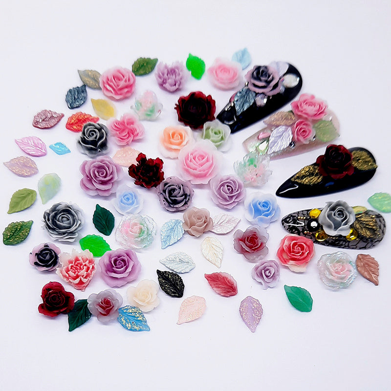 Colourful flowers and decorative leaves used in nail art decoration on a white background
