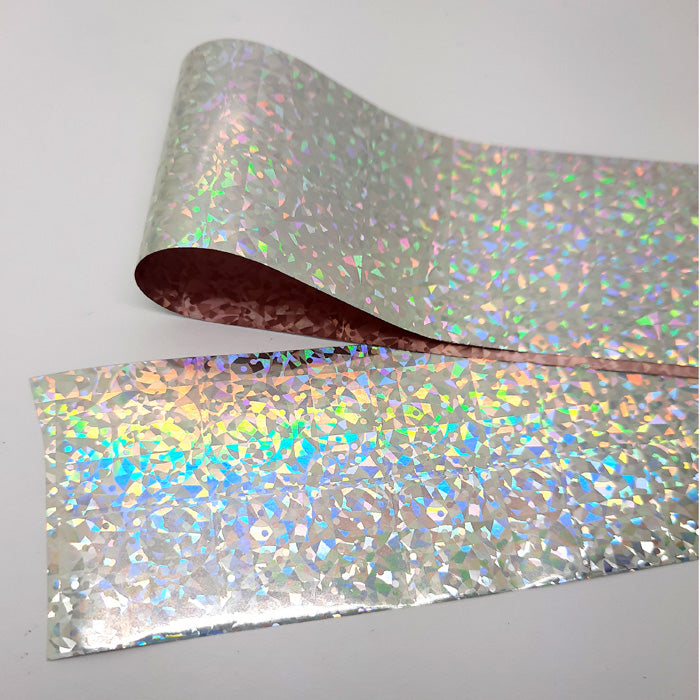 Sparkling Silver Flecks Nail Transfer Foil. This is such a fabulous foil, great for just dabbing onto tacky nails to add some silver holo sparkle to your designs.
Supplied in 4cm x 100cm lengths.