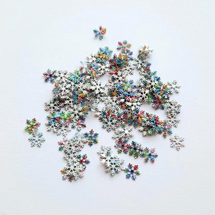 multicoloured snowflakes on a white background used for nail art