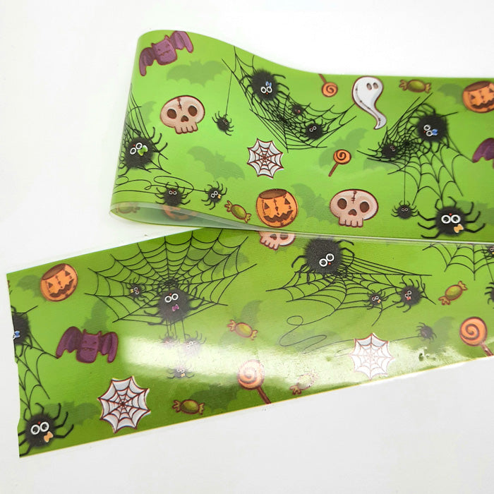 Spooky Spiders Halloween Nail Foil, a green foil with cute and spooky designs.
