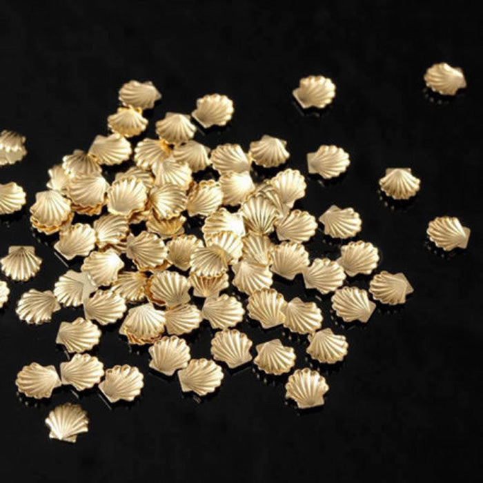 Tiny Gold Shell Nail Charms, Set of 10. So cute. Use them for all your holiday nails, junk nails, and all beach related nail designs.