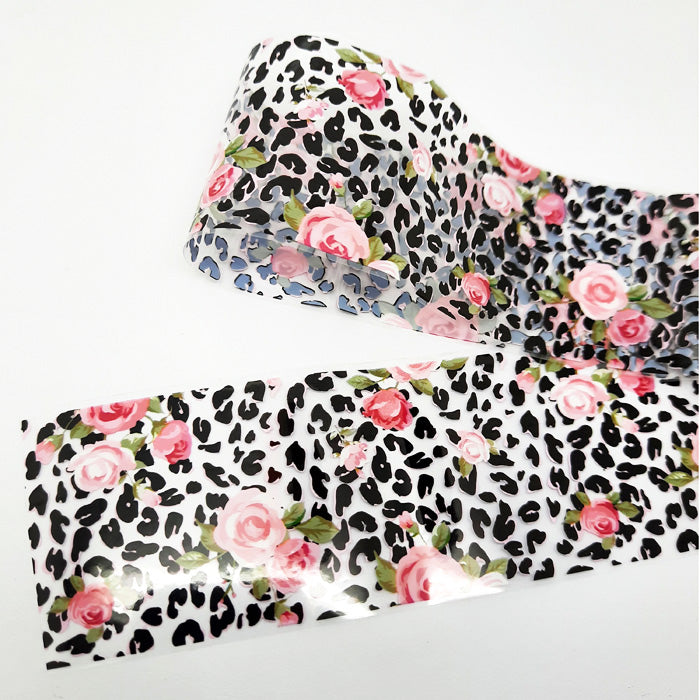 Leopard print nail foil with pink flowers on a white background