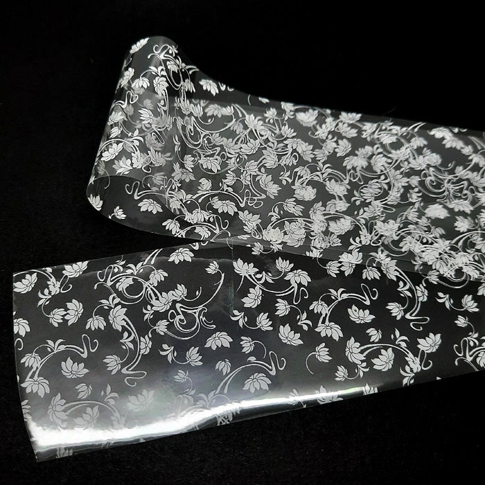 White Flowers Nail Transfer Foil. I love this foil, beautiful white flowers on a clear backing.
Supplied in 4cm x 100cm lengths.