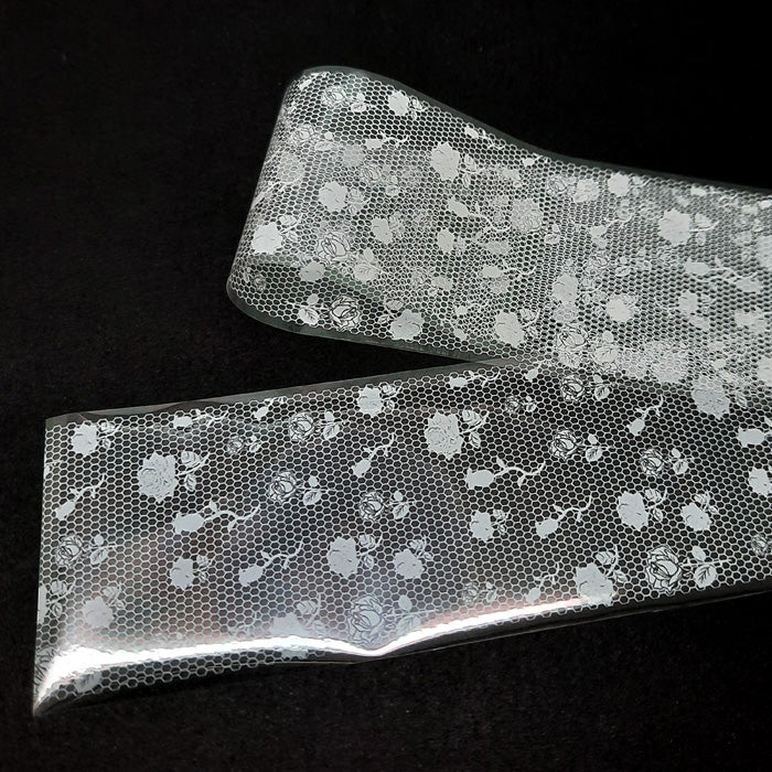 White Roses on Net Lace Nail Foil. Beautiful roses on net/mesh.
Supplied in 4cm x 100cm lengths.