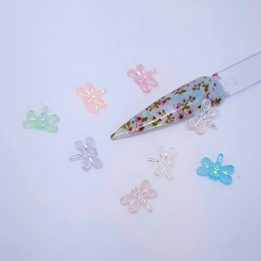 Pretty Aurora Dragonfly Nail Decoration x 5. Absolutely beautiful dragonflies in a mix of colours. Flat backed.