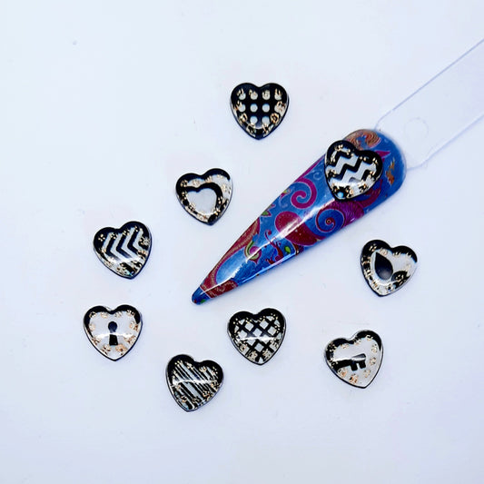 Black + White Resin Heart Nail Charms x 10, with added gold glitter. Supplied in a random mix of designs.