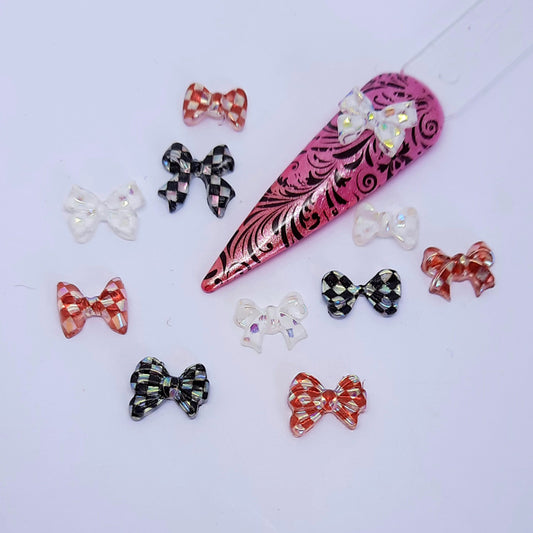 Checked Aurora Bows Nail Charms x 10. Beautiful and shimmering, in a mix of colours and a mix of bow styles.