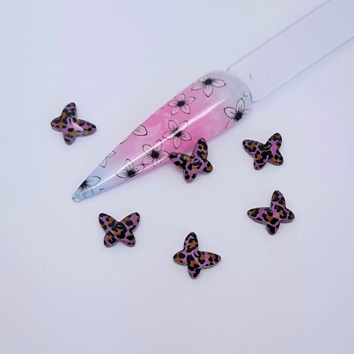 Clear Resin Animal Print Butterfly Charms x 4, Pink. Beautiful butterflies. Other colours also available, plus matching heart charms.