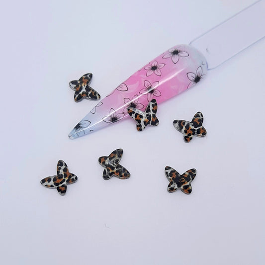 Clear Resin Animal Print Butterfly Nail Charms x 4, White. Beautiful butterflies. Other colours also available, plus matching heart charms.