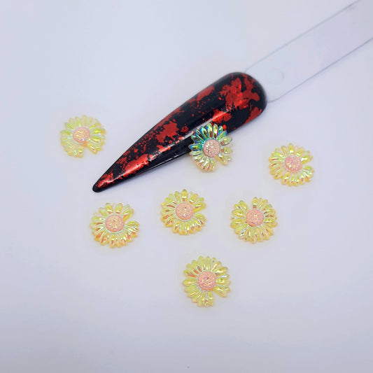 Cute Aurora Flowers Nail Charms x 5. Large shimmering yellow daisy type flowers, flat backed. Also available in pink.