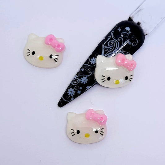 some white Hello Kitty nail art