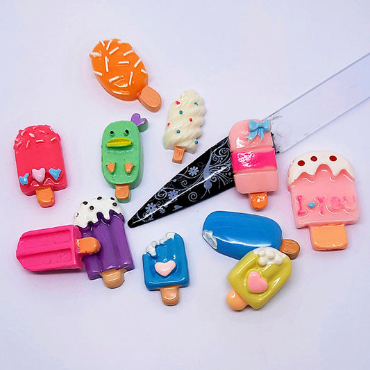 Colourful ice cream-shaped nail art charms on a white background