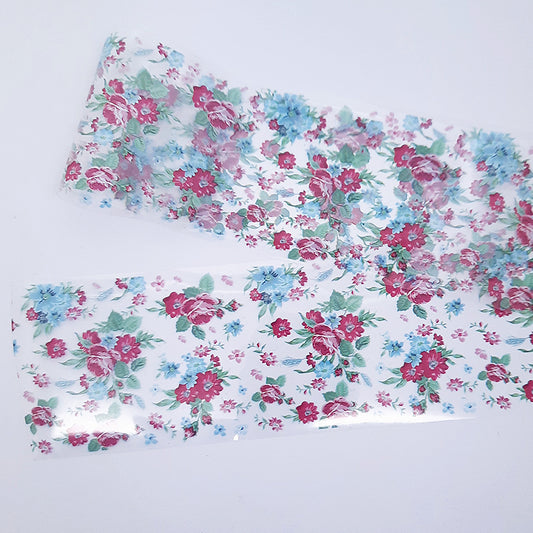 Floral patterned nail foil with pink, blue, and green flowers on a white background