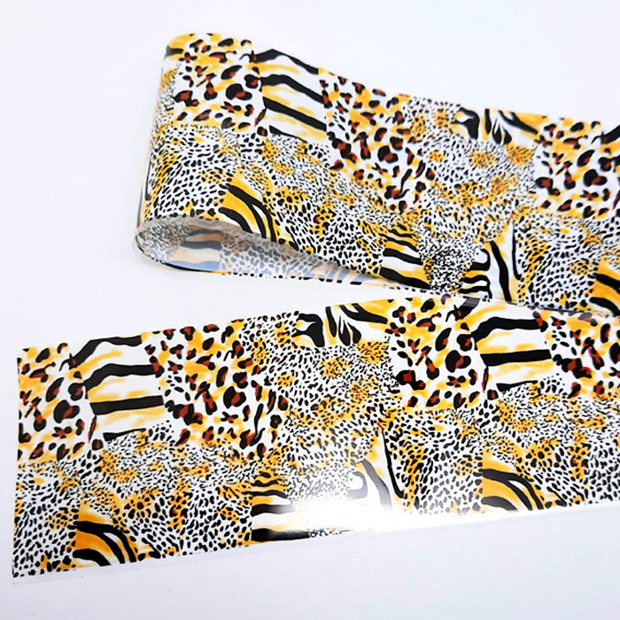 A strip of abstract animal print nail art foil on a white background