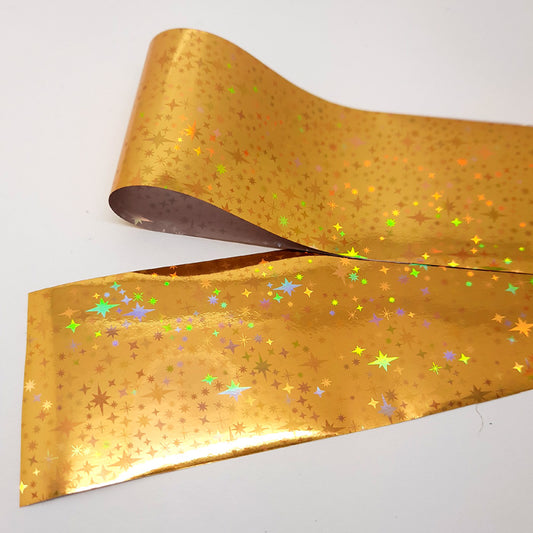 Gold Holo Stars Nail Transfer Foil, beautiful metallic foil with holo stars.

Supplied in 4cm x 100cm lengths.