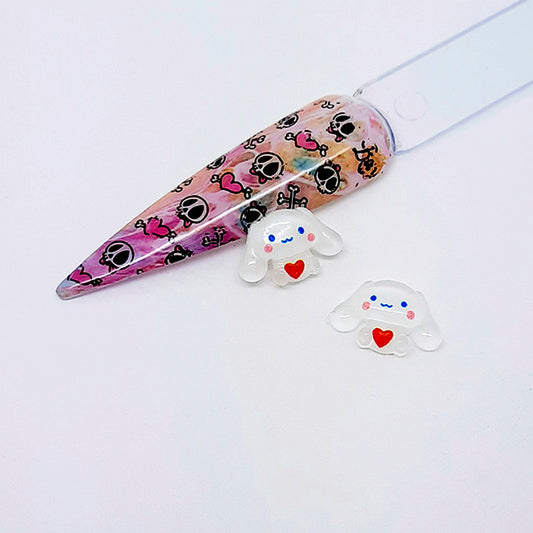 kawaii Cinnamoroll nail art charms displayed with a nail tip on a white background