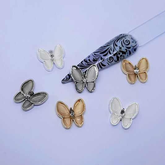 Pearly Butterfly Nail Charms x 6. Beautiful large pearly butterfly nail charms, come in a pack of mixed colours.