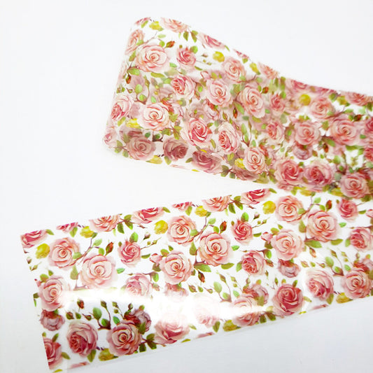 Floral nail art foil with pink roses displayed on a white background
