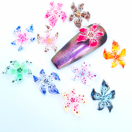 Colourful flower nail art decorations on a white background