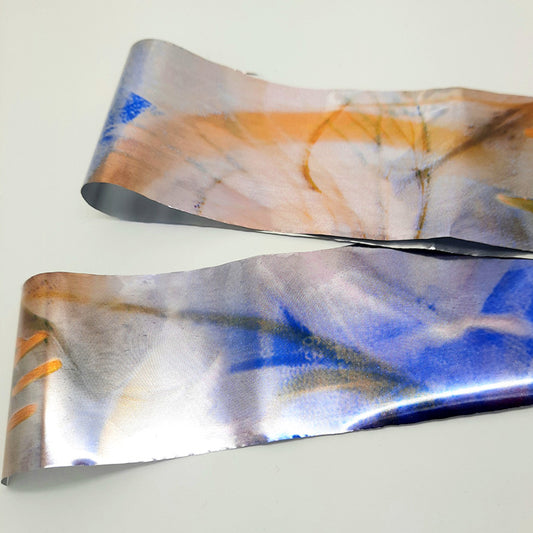 Metallic Nail Foil, Abstract.&nbsp; Lovely abstract splashes of colour on this metallic nail foil. It transfers really easily.

Supplied in 4cm x 100cm lengths.