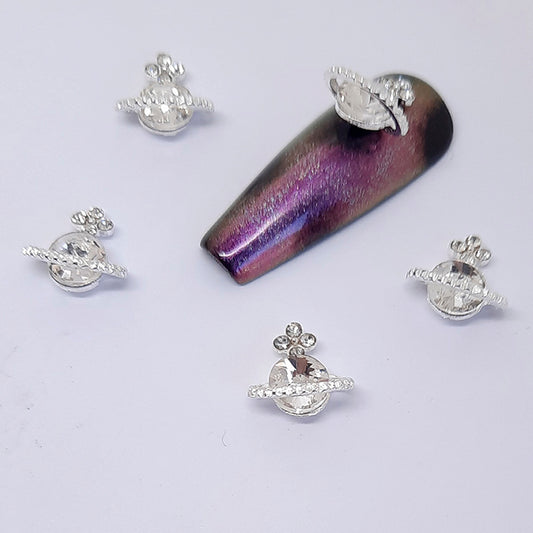 Planet Orb Nail Charms x 4, Clear. Beautiul large clear gem set into silver metal, with some added clear gems. Other colours also available.