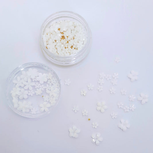 Flowers + Gold Caviar Beads Nail Decoration, White. Gorgeous little white 3d flowers in mixed sizes, with added gold caviar beads, which you can use in the centre of the flowers if required.