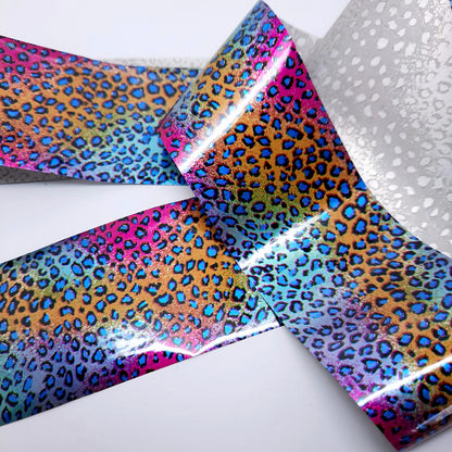 Holographic metallic nail art foil with colourful leopard print pattern on a white background
