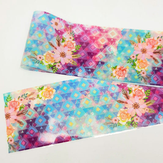 A colourful strip of nail art foil with a geometric and floral design on a white background.