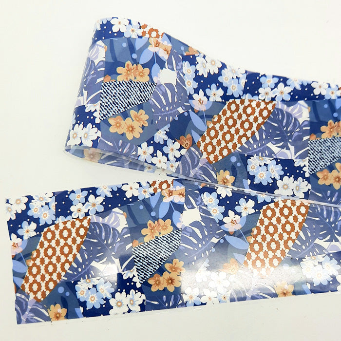 Floral and leaf patterned nail art foil on a white background