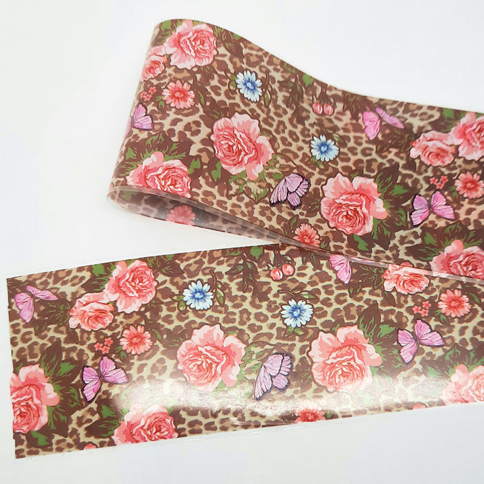 Roll of floral and leopard print patterned nail art foil on a white background
